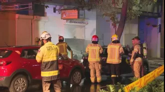 Dozens flee Sydney building as e-bike catches fire, prompting evacuation.