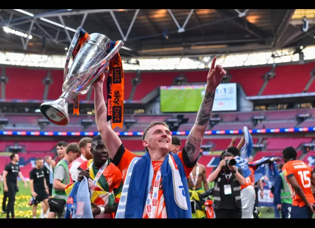 What is the prize for winning the Championship play-off final and moving up to the Premier League?