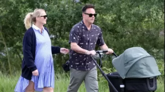 Ant McPartlin, a devoted father, takes his new baby for a walk with his wife Anne-Marie Corbett.