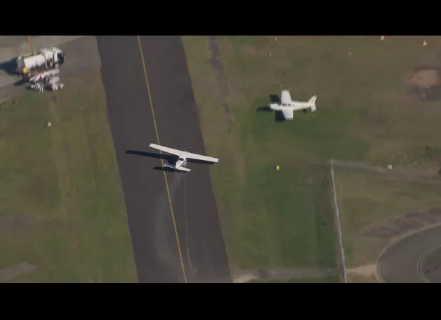 Small aircraft safely lands at Bankstown Airport after experiencing problems.