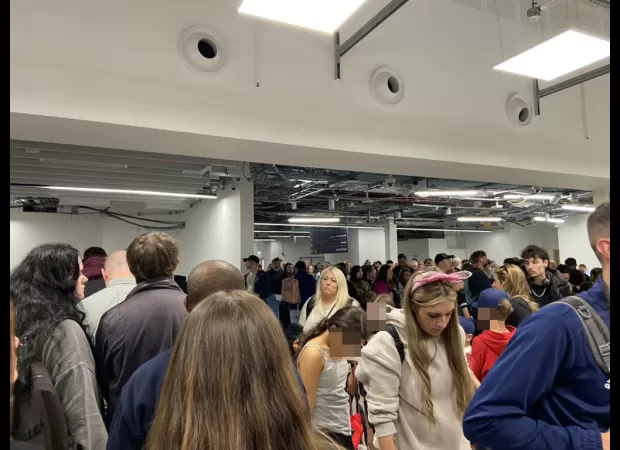 Major UK airport experiences travel chaos with long lines and delays for passengers.