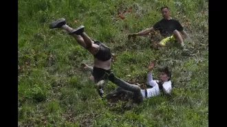 People who love cheese disregard caution and participate in an annual event where they roll down a hill.