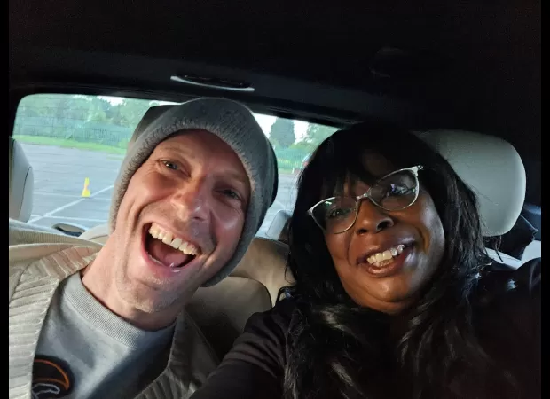 Coldplay frontman gives wheelchair user lift to show and hints at split with actress Johnson.