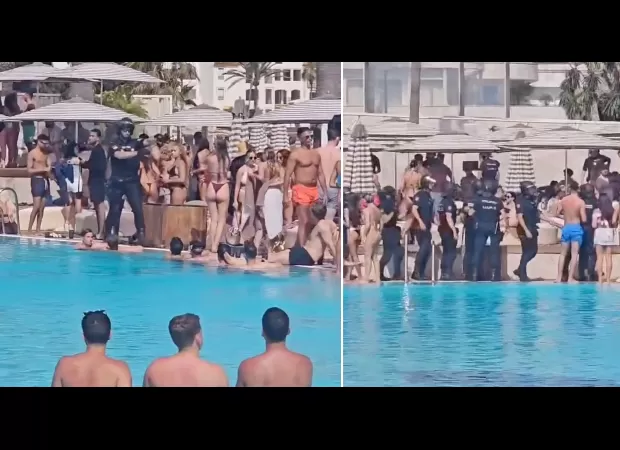 Police with weapons enter Marbella beach club and tell individuals to leave the pool.