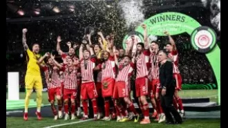 Greece celebrates as Olympiakos wins first European title with 1-0 victory over Fiorentina.