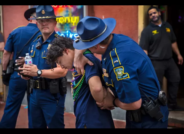 Louisiana's new law prohibits standing too close to police.