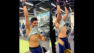 Kartik Aaryan shows off toned abs while doing weight-lifted pull-ups.
