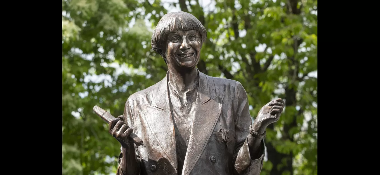 Car crashes into Victoria Wood statue, leaving it standing at a nearly vertical angle.