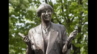 Car crashes into Victoria Wood statue, leaving it standing at a nearly vertical angle.