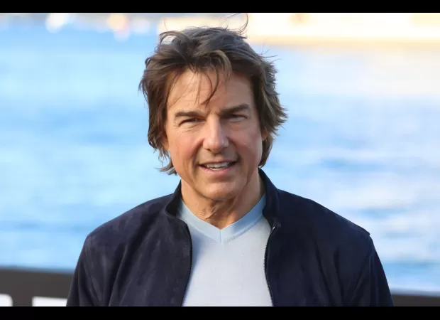 Tom Cruise almost hops into Rishi Sunak's car in London.