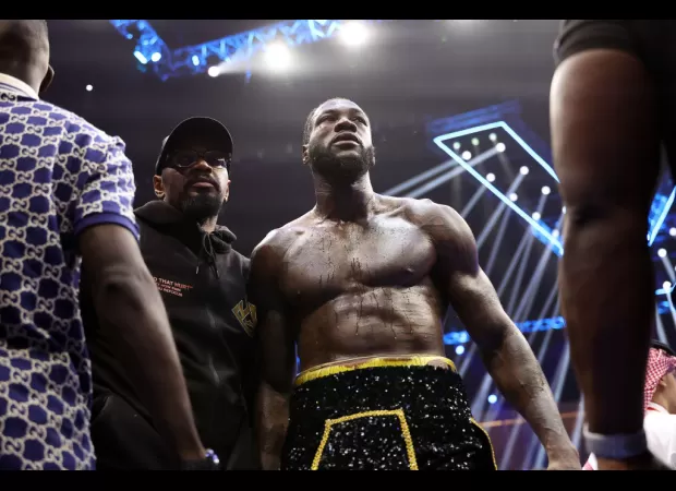 Wilder's mother urges him to retire from boxing after losing to Zhang.