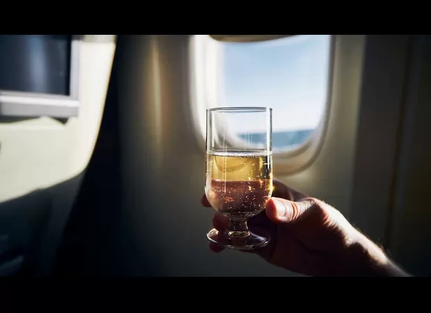 Don't consume alcohol before sleeping on a flight as it can have negative effects on your current and future well-being.