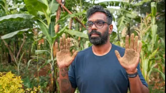 Romesh Ranganathan remains calm after handling cow feces with his bare hands.