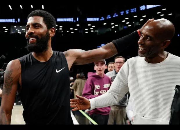 Kyrie Irving signs his father Drederick to a shoe deal, showcasing his commitment to family.