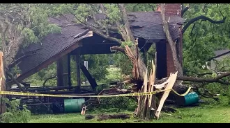 2-year-old dies after tornado throws tree onto bed while sleeping.
