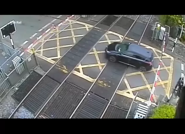 A female is injured by a descending train gate.