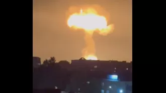 A gas explosion at a filling station creates a massive mushroom cloud in the sky.