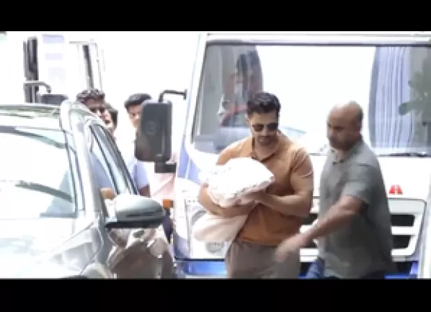 Varun Dhawan brings newborn daughter and wife Natasha home from hospital.