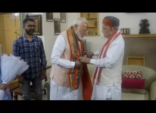 PM Modi meets with senior BJP leaders Advani and Joshi before taking oath for third term as prime minister.