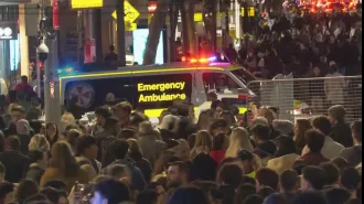 Massive crowd frenzy at Sydney Harbor for Vivid drone event.