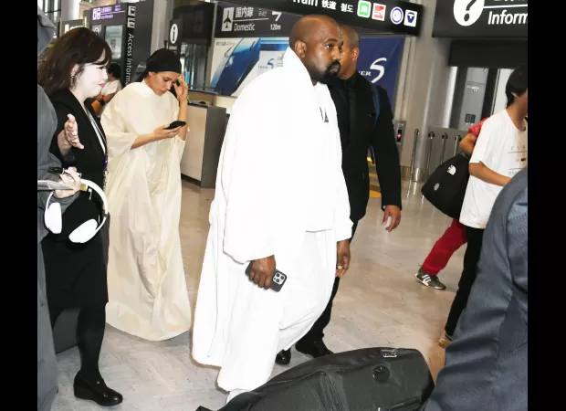 Kanye West and Bianca Censori make a bold fashion statement as they land in Japan.