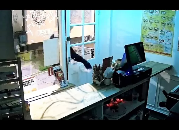 A burglar's clever hiding place in a restaurant didn't fool the police.