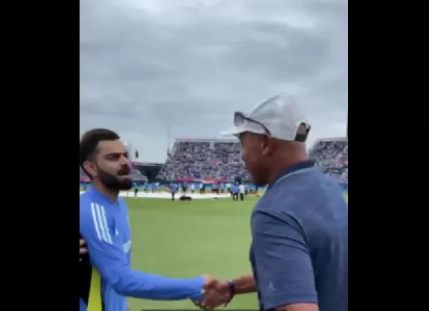 Kohli, Yuvraj, and Bumrah meet NBA legend John Starks after India's victory over Pakistan in T20 World Cup.