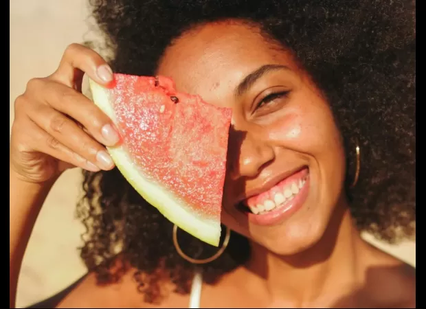 A guide to celebrating Juneteenth with watermelon and red birds, including recipes and cultural significance.