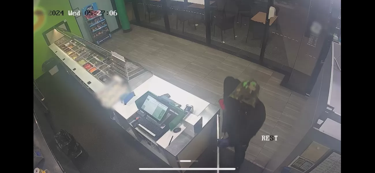 CCTV footage shows man using knife to rob fast food restaurant in Queensland.