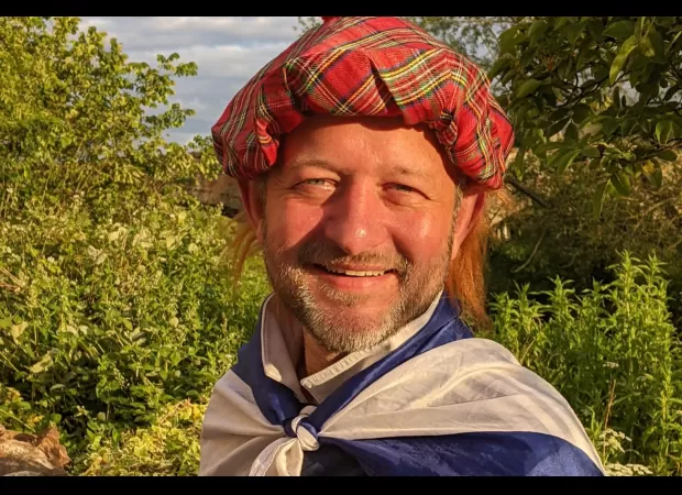 A Scottish soccer supporter whose life was saved by an opponent now has 