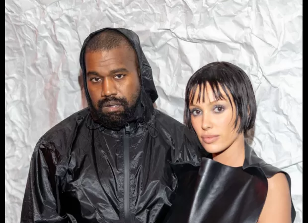 Kanye West and Bianca Censori unexpectedly flew economy class to Japan, surprising travellers.