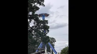 Rescue team saves 30 individuals stuck upside down on a US amusement park ride.