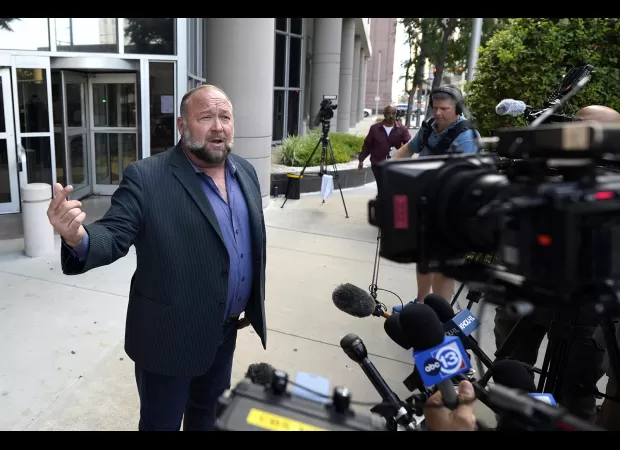 Assets of Sandy Hook conspiracy theorist sold to repay debt.