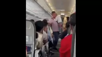 Flight delayed due to uncooperative child not wearing seatbelt.