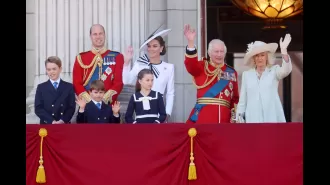 Kate rejoins the royal family on the palace balcony, bringing everyone together.