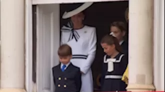 Prince Louis charms the crowd with his dancing skills at the royal balcony event.