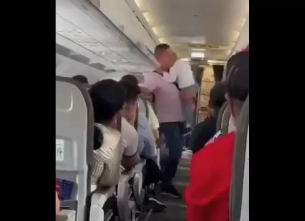 Flight delayed due to uncooperative child not wearing seatbelt.