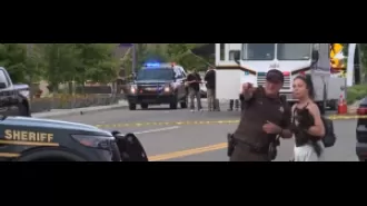 Gunman in Detroit suburb injured eight people, including two children, by opening fire.