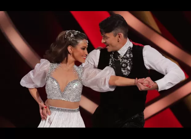 A celebrity from Dancing on Ice reflects on her difficult separation from her husband when she developed feelings for her skating partner.