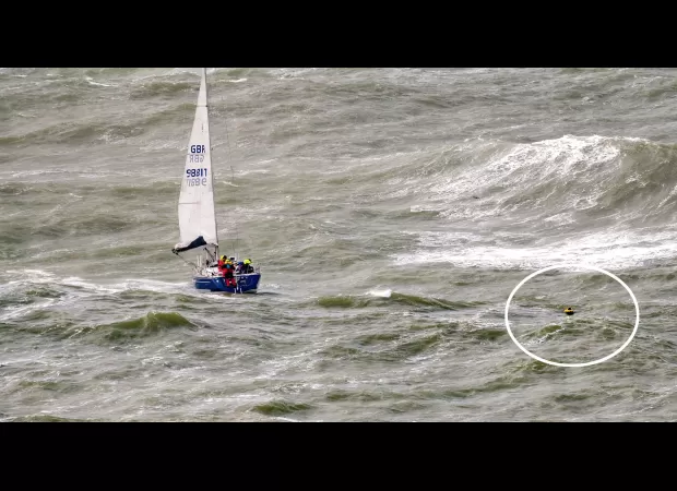 Two boats collided and a sailor was thrown into the water in a terrifying accident.