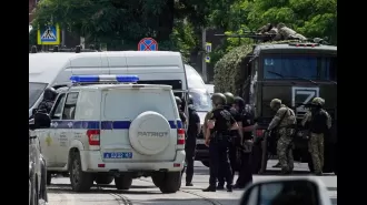 Russian troops raid jail to free captured workers, eliminating captors.