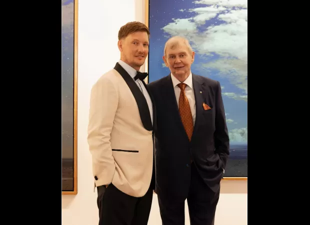 John Farnham, a famous musician, looking happy at his son's wedding.