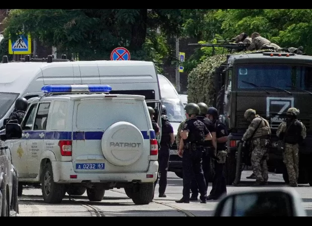 Russian troops raid jail to free captured workers, eliminating captors.