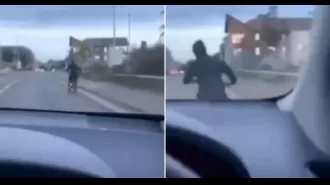 A man on an electric bike is intentionally hit by a driver.
