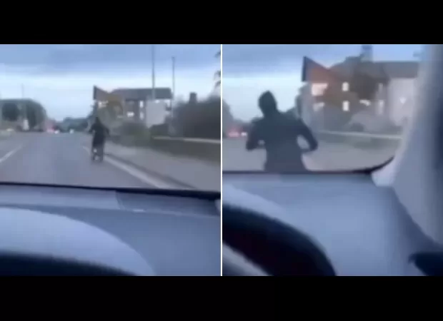 A man on an electric bike is intentionally hit by a driver.