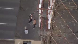 Helicopter sees teenagers climbing 14 floors in Melbourne.