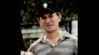 After two decades, a man has been accused of committing murder when a body was discovered in a river.