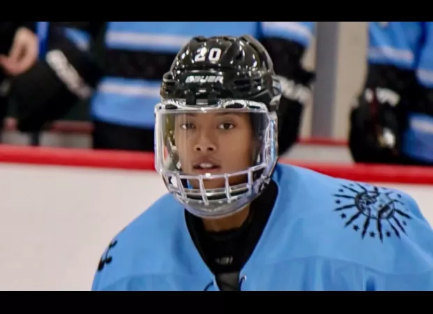 Trailblazing Black woman joins National Women's Hockey League, advocates for inclusivity.