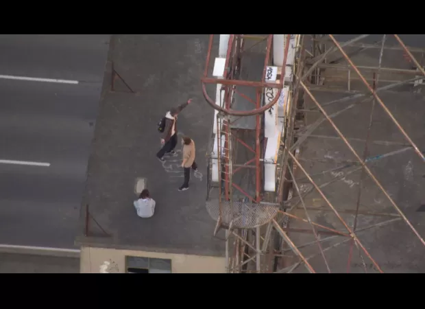 Helicopter sees teenagers climbing 14 floors in Melbourne.