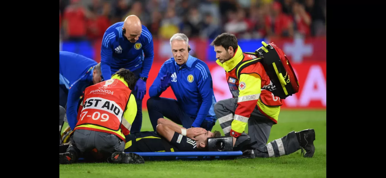 Kieran Tierney injured in Scotland's Euro 2024 game against Switzerland, taken off on a stretcher.